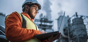 Engineering recruitment - engineer using a laptop while working